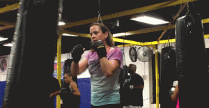 Charlotte punching during Kickboxing class.