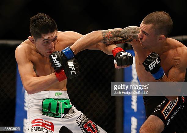 (Training spotlight at x3sports) LAS VEGAS, NV - DECEMBER 29: Byron Bloodworth (right) punches Erik Perez during their bantamweight fight at UFC 155 on December 29, 2012 at MGM Grand Garden Arena in Las Vegas, Nevada. (Photo by Josh Hedges/Zuffa LLC/Zuffa LLC via Getty Images)