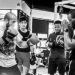 2 men practicing kickboxing