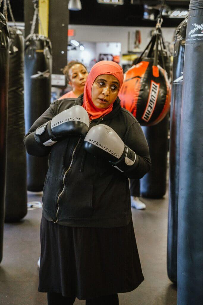 Picture showing a woman in a hijab during a women's kickboxing class at X3 Sports.