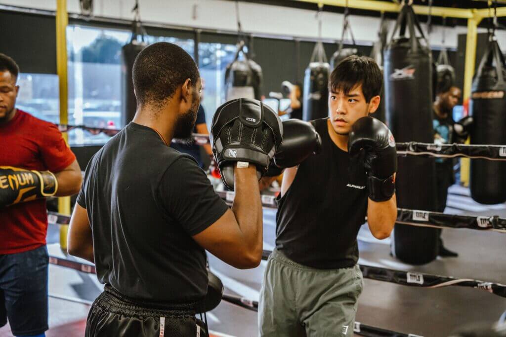 In addition to heavy bag workouts, working with a partner is a great way to prepare for boxing. 