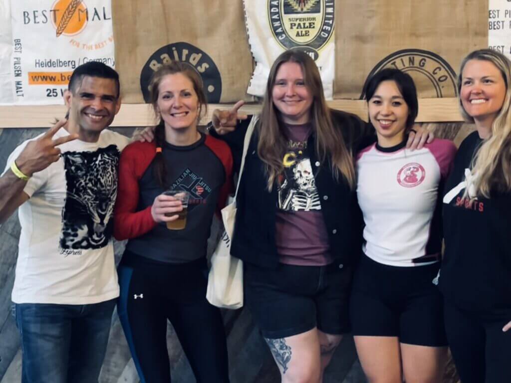 A picture of Mandy celebrating after a jiu jitsu competition.